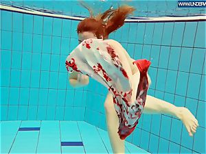 red-hot grind redhead swimming in the pool
